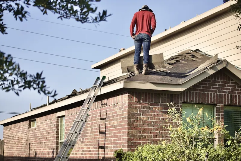 Professional roofer working on a residential roof in Historic Murrieta